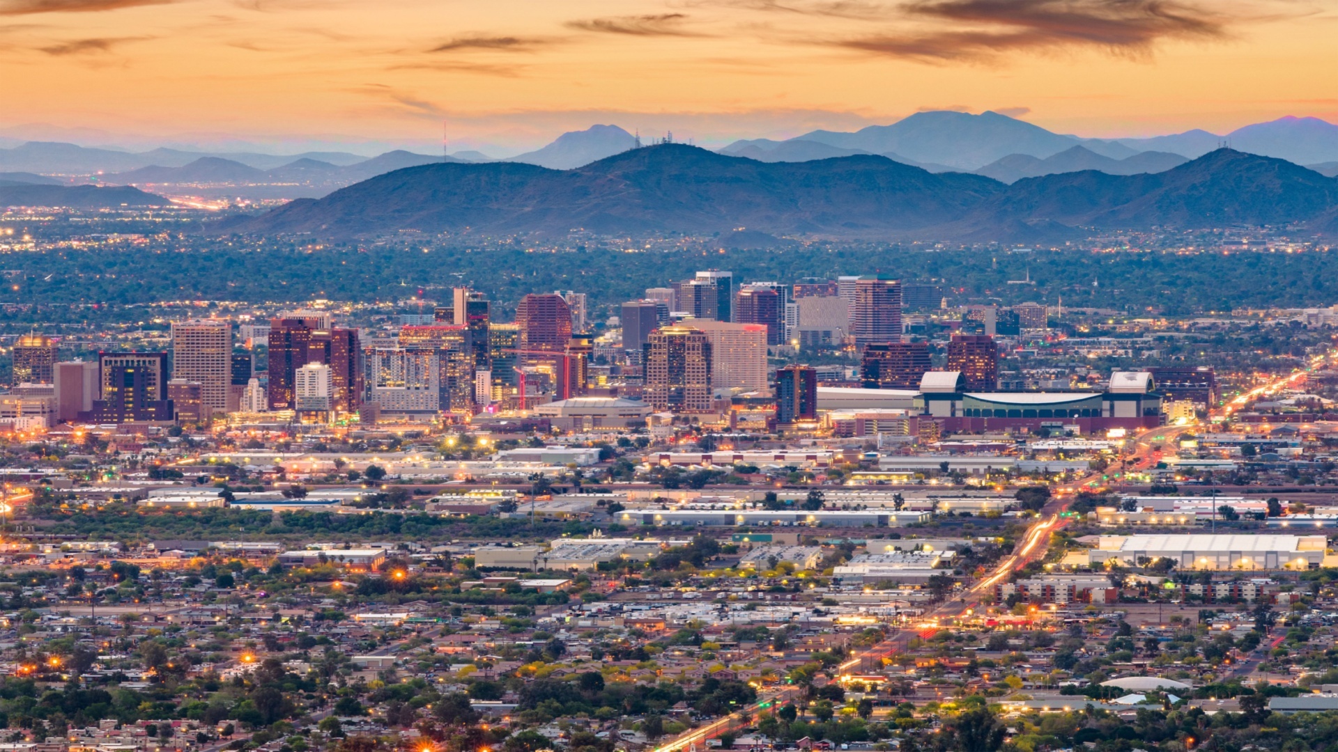 The Phoenix skyline at sunset with the surrounding valley and mountains
